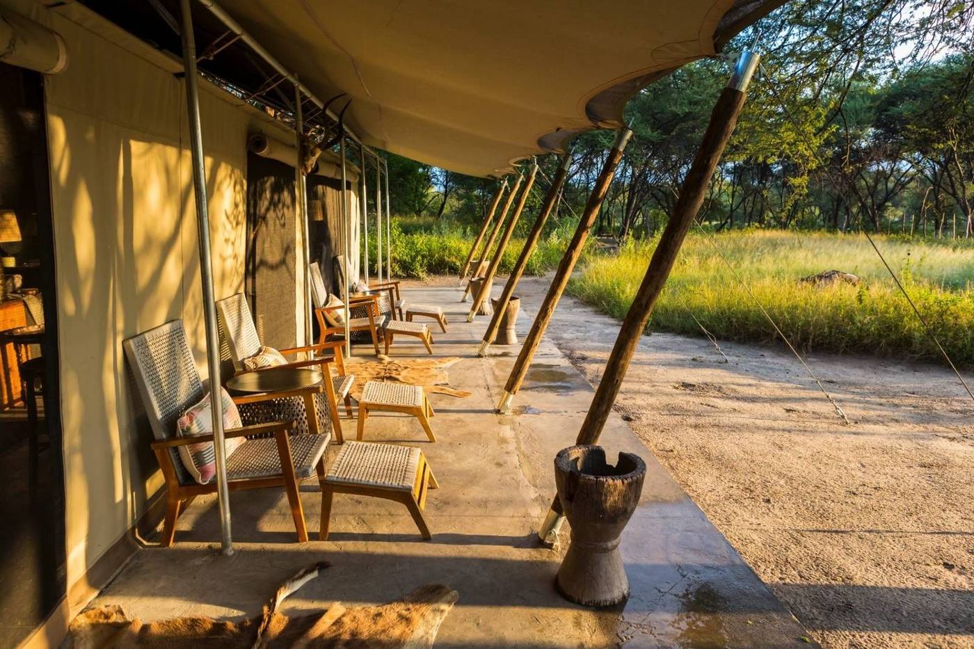 Warm lantern light inside a private safari camp